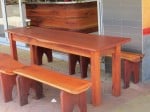 Outdoor setting with a timber bench seat