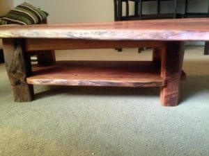Slab coffee table with lower shelves