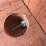 Lag bolts joining a waterfall edge vanity