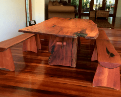 Timber slab dining table with bench seats