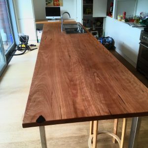 Hardwood island bench, side view