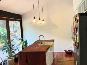 Waterfall edge timber benchtop, end view